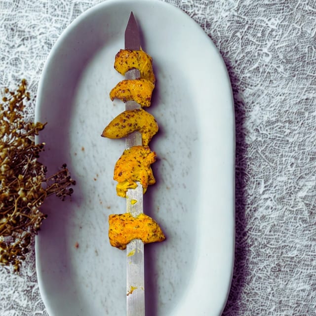 SKEWER MOUSSA'S FAMOUS CHICKEN.